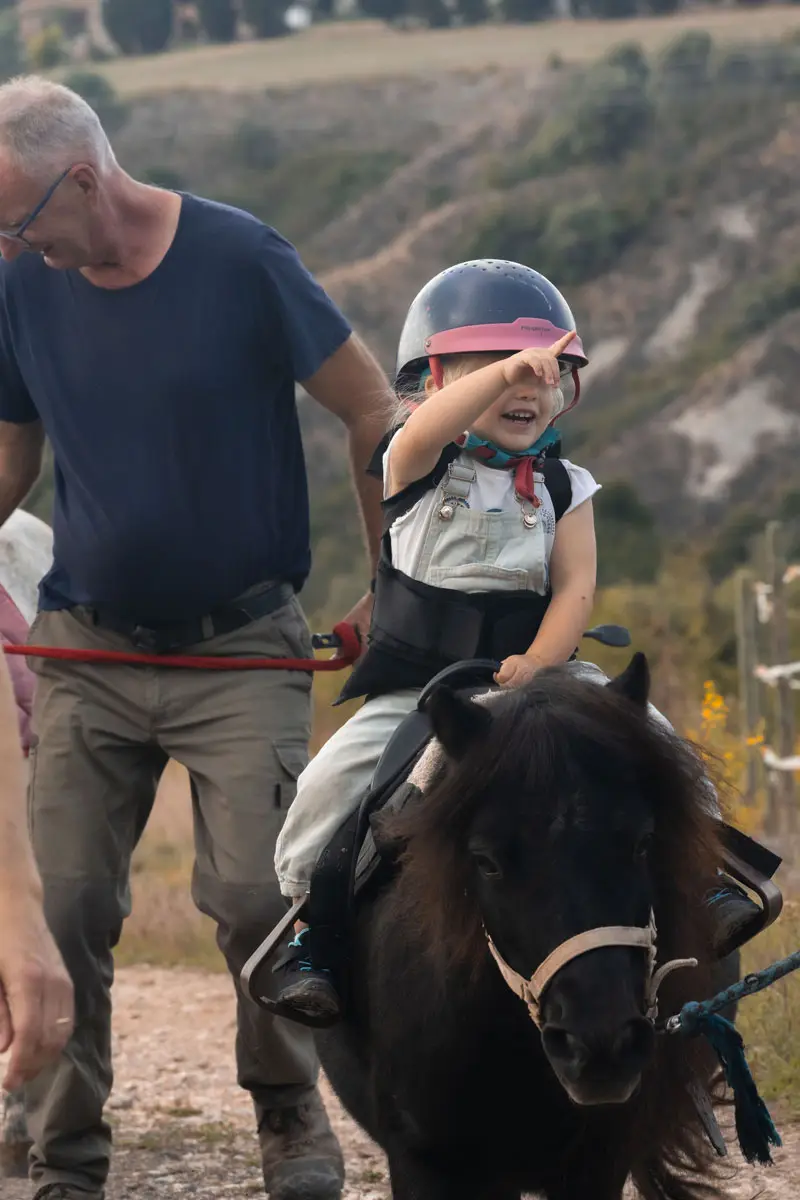 kid.riding.pony.montaione